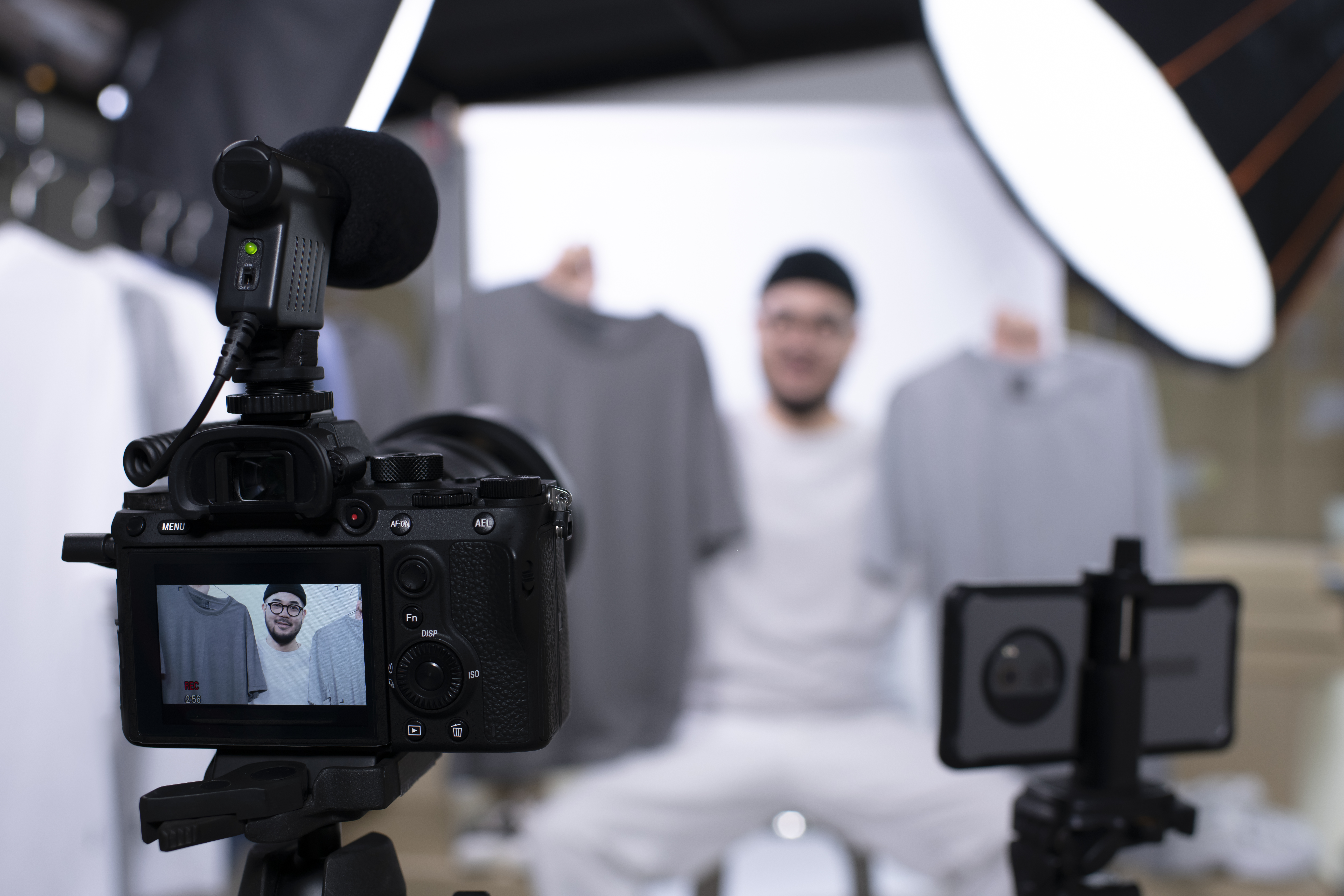 video-journalist_apextv Young attractive Asian man blogger or vlogger looking at camera reviewing product. Modern businessman using social media for marketing. Business online influencer on social media concept.